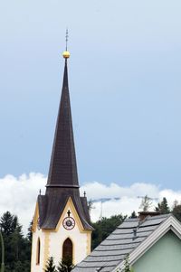 Tower amidst buildings against sky