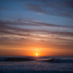 Scenic view of sea at sunset