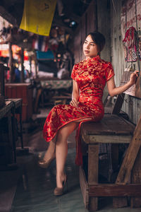 Young woman in traditional clothing sitting