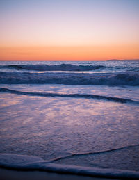 Scenic view of sea at sunset