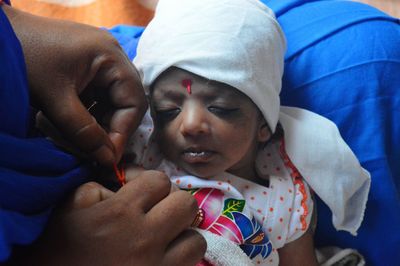 Close-up of woman hands holding baby