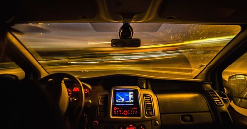 Close-up of man driving car