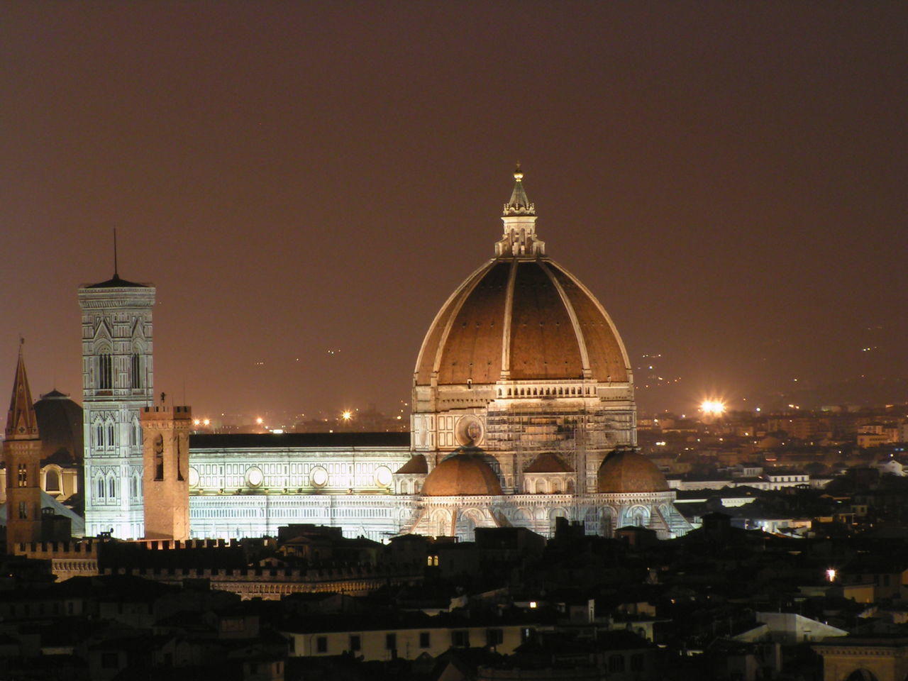 VIEW OF ILLUMINATED CATHEDRAL AGAINST SKY