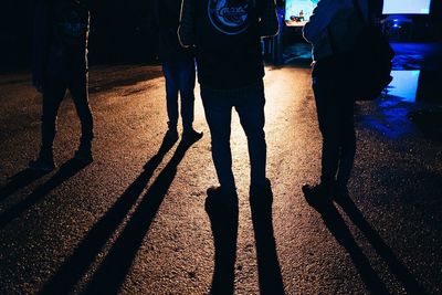 Shadow of woman on pavement