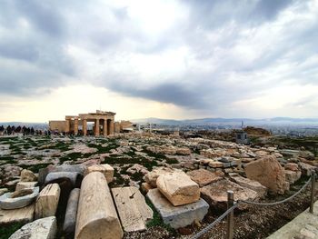 High angle view of ruins of building against cloudy sky