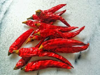 High angle view of red chili peppers on table