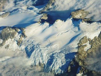 Scenic view of snow covered mountains against sky