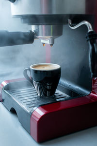 Close-up of coffee cup on table