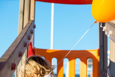 Close-up of boy against clear sky