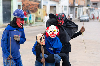 Unidentified people are seen wearing horror costumes and masks in the acupe district 
