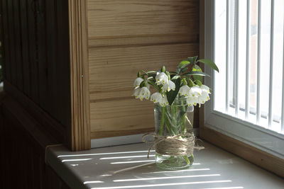 Flower vase on table at home