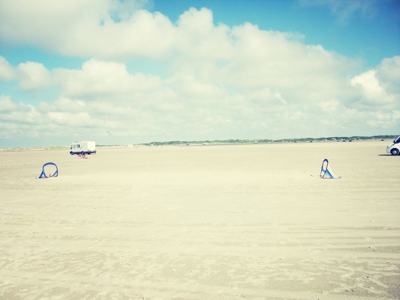 sea, water, sky, beach, transportation, nautical vessel, mode of transport, cloud - sky, leisure activity, sand, lifestyles, tranquility, scenics, horizon over water, tranquil scene, shore, boat, men, nature