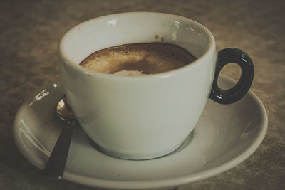 Close-up of coffee cup on table