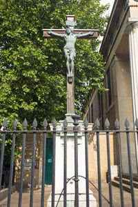 Low angle view of statue against trees