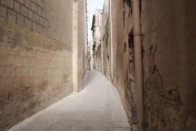 Narrow alley along buildings