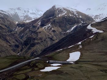 Scenic view of snowcapped mountains and lake during winter