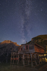 Buildings against sky at night