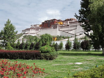 View of buildings against cloudy sky