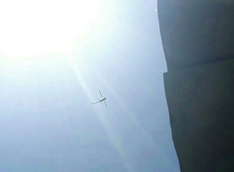 LOW ANGLE VIEW OF AIRPLANE FLYING ABOVE THE SKY