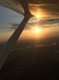 Scenic view of sunset seen through airplane window