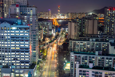 High angle view of illuminated city buildings at night