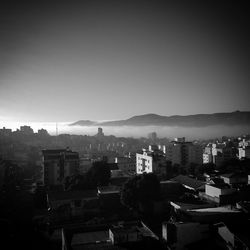 Cityscape with mountain range in background