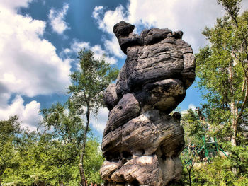 Low angle view of tree mountain against sky