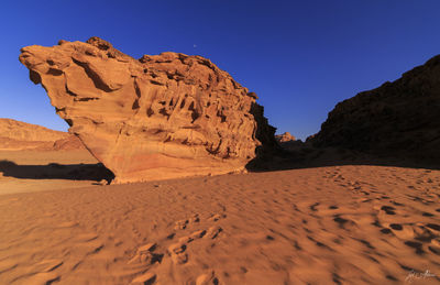 Scenic view of desert against clear sky