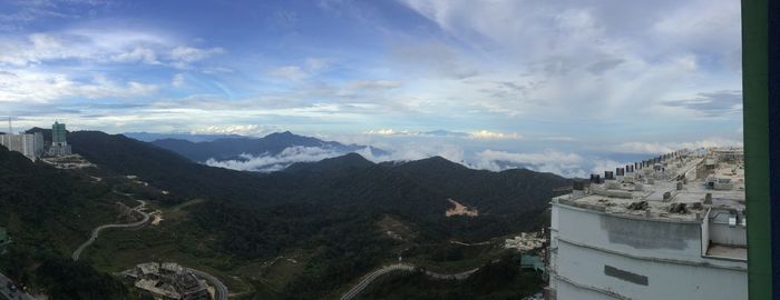 High angle view of buildings and mountains against sky