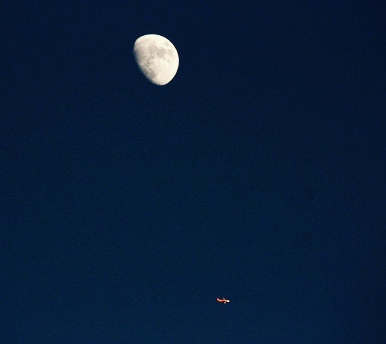 LOW ANGLE VIEW OF MOON IN SKY