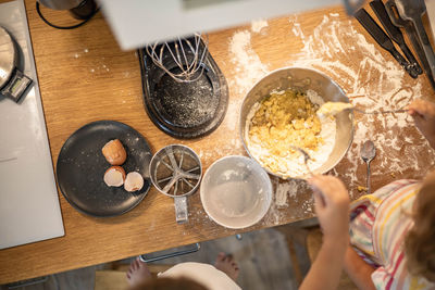 High angle view of person preparing food on table