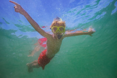 High angle view of man swimming in sea