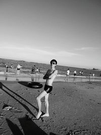 Woman standing on beach