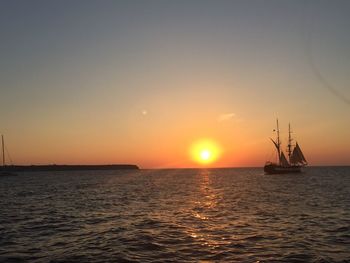 View of ship sailing in sea during sunset