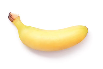 High angle view of yellow fruit against white background