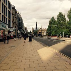 City street against cloudy sky