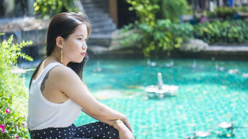 Woman looking at swimming pool