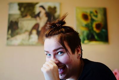 Portrait of smiling woman at home