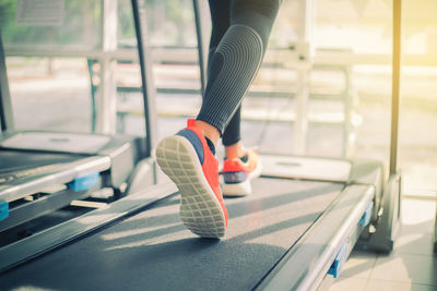 Low section of woman on treadmill