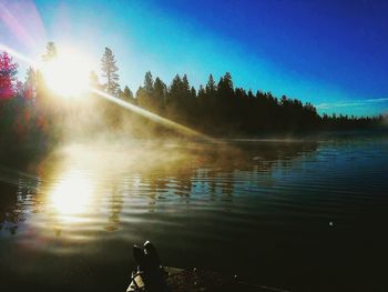 Sun shining over lake