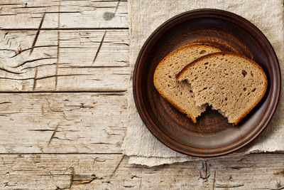 Directly above shot of bread on wooden wall