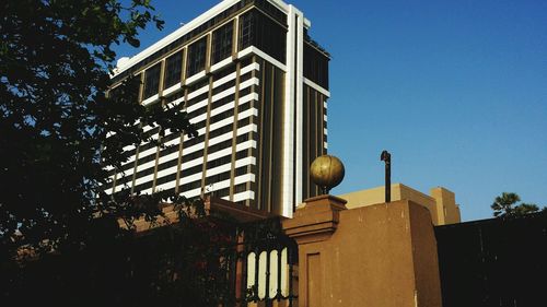 Low angle view of building against blue sky