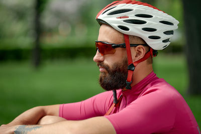 Side view of man wearing hat