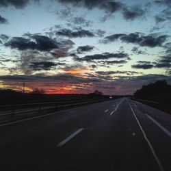 Empty road at sunset