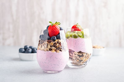 Close-up of fresh fruits in glass on table
