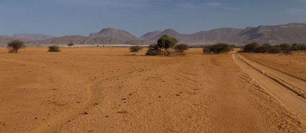 Scenic view of desert against sky