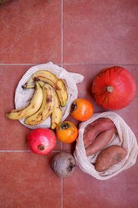 Directly above view of fruits and vegetables on tiled floor
