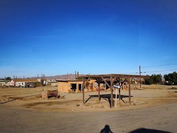 Construction site against clear blue sky