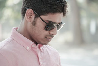Close-up of young man with sunglasses
