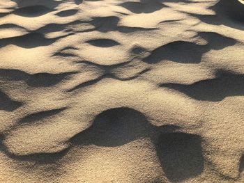 High angle view of shadow on sand